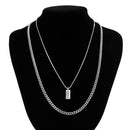 KunJoe – Conjunto de 2 Colares Masculinos Estilo Punk | Corrente Cubana + Choker com Elos Retangulares
Complete o seu visual com este conjunto exclusivo de 2 colares em prata metálica. Composto por uma corrente cubana robu