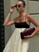 Vestidos longos de linho feminino com alças, em estilo patchwork preto e branco. Com detalhes plissados e corte solto, oferecem conforto e elegância. O contraste de cores confere um toque moderno e sofisticado, perfeito par