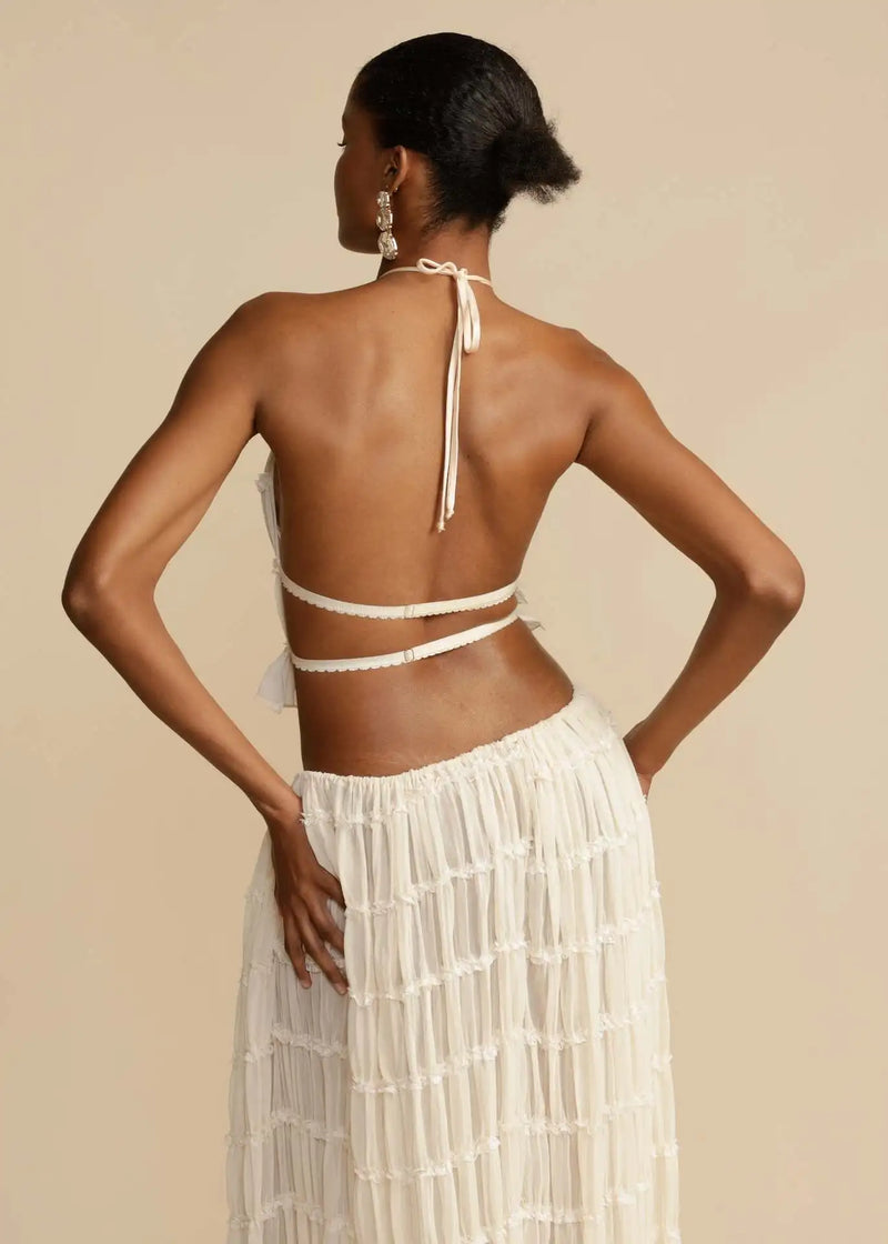 Conjunto Feminino Verão 2024 – Elegância & Estilo em 2 Peças
Descubra o charme do verão com este conjunto feminino exclusivo, composto por uma saia longa maxi plissada e um top com decote halter e costas nuas, realçado