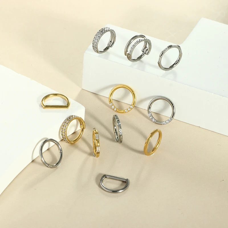 Piercing em Titânio G23 – Argola com Fecho Segmentado e Zircónia CZ (16G)
Versátil e elegante, este piercing é ideal para nariz, cartilagem da orelha, trágus, hélice e daith. Fabricado em titânio cirúrgico G23 — r