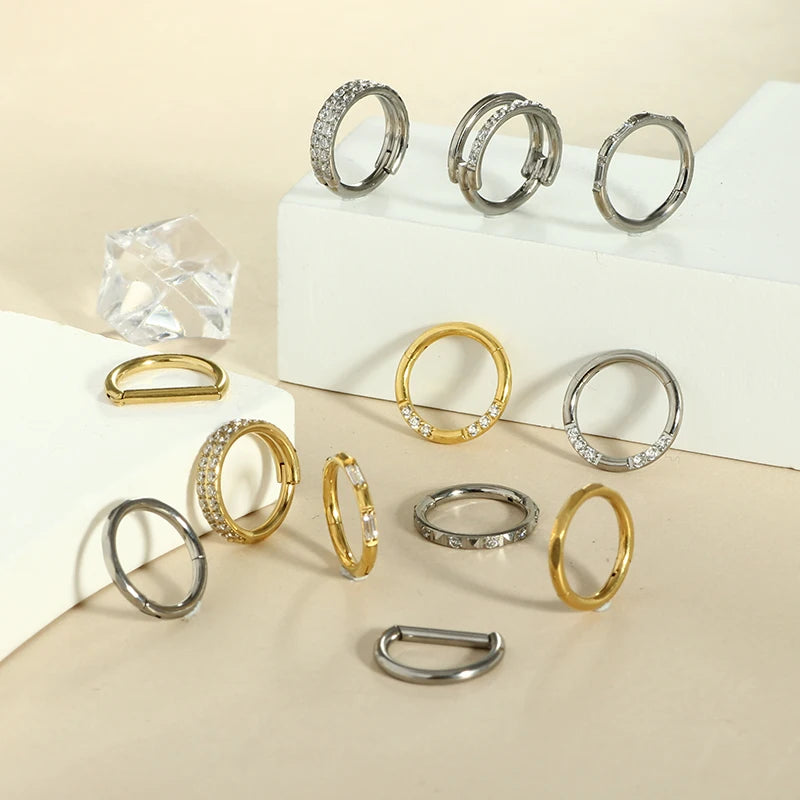 Piercing em Titânio G23 – Argola com Fecho Segmentado e Zircónia CZ (16G)
Versátil e elegante, este piercing é ideal para nariz, cartilagem da orelha, trágus, hélice e daith. Fabricado em titânio cirúrgico G23 — r