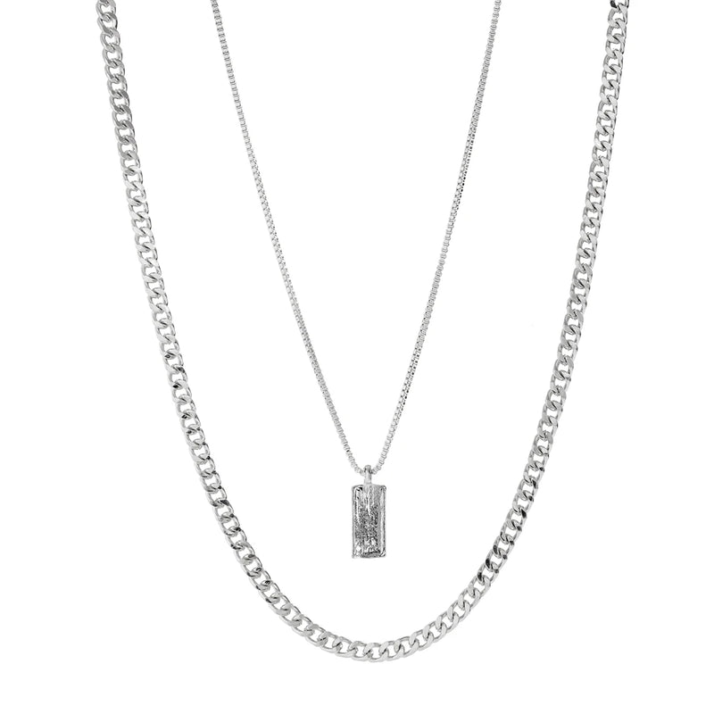 KunJoe – Conjunto de 2 Colares Masculinos Estilo Punk | Corrente Cubana + Choker com Elos Retangulares
Complete o seu visual com este conjunto exclusivo de 2 colares em prata metálica. Composto por uma corrente cubana robu