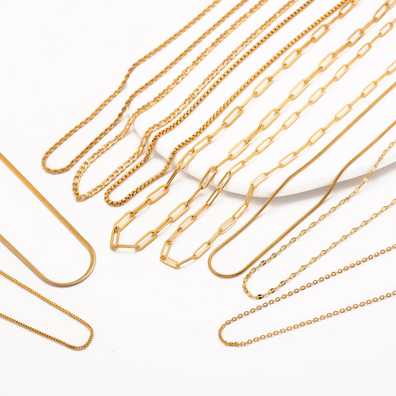 Colar em Aço Inoxidável Dourado 18K – Corrente Ajustável com Design Cruz, Cubana ou Ripple (5 unidades)
Eleve o estilo com este conjunto de colares premium em aço inoxidável, com revestimento PVD em dourado 18K, que ga