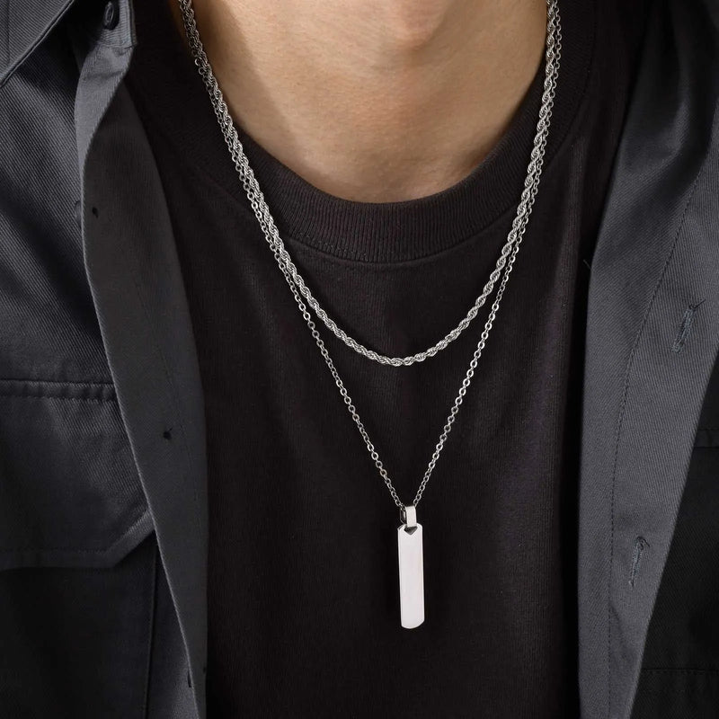 Descrição Melhorada:
Conjunto de Colares Masculinos Estilo Empilhado – Elegância Moderna e Atitude Urbana

Descubra este conjunto exclusivo de colares empilhados para homens e rapazes, que combina uma corrente cubana em