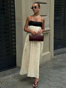 Vestidos longos de linho feminino com alças, em estilo patchwork preto e branco. Com detalhes plissados e corte solto, oferecem conforto e elegância. O contraste de cores confere um toque moderno e sofisticado, perfeito par