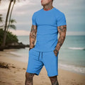 Conjunto masculino de verão 2025 – Camisa de manga curta e calções desportivos
Desenhado para homens ativos, este conjunto combina estilo e conforto com tecidos respiráveis e de secagem rápida. Ideal para os dias quent