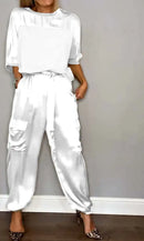 Conjunto Feminino Elegante – Verão 2024
Camisa de Seda com Calças Casuais | Estilo Chic & Conforto

Descubra o look perfeito para os dias quentes! Este conjunto feminino em duas peças combina o charme da camisa de seda l