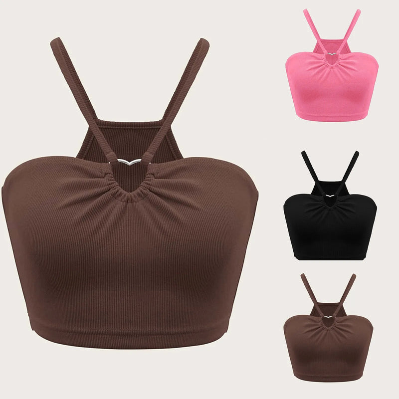 Blusa sem mangas, justa e com design moderno, perfeita para destacar a silhueta. Possui alças cruzadas ultra curtas e um estilo ousado e sensual, com acabamento levemente dessaturado que traz um toque urbano e sofisticado à