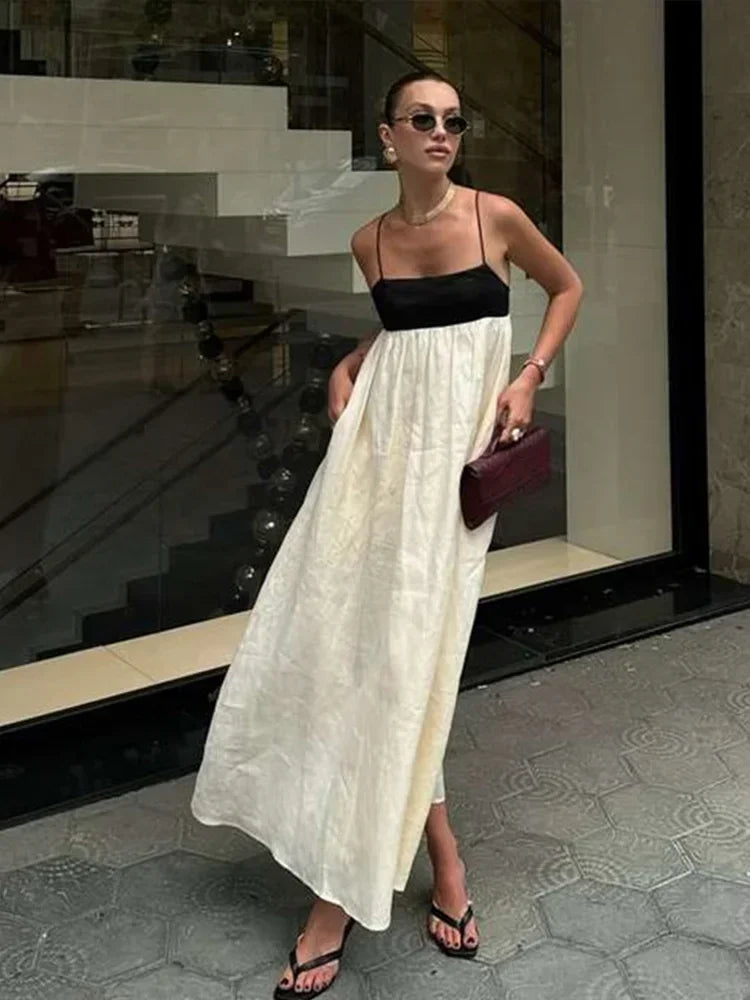 Vestidos longos de linho feminino com alças, em estilo patchwork preto e branco. Com detalhes plissados e corte solto, oferecem conforto e elegância. O contraste de cores confere um toque moderno e sofisticado, perfeito par