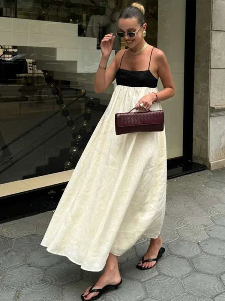 Vestidos longos de linho feminino com alças, em estilo patchwork preto e branco. Com detalhes plissados e corte solto, oferecem conforto e elegância. O contraste de cores confere um toque moderno e sofisticado, perfeito par