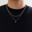 Conjunto de 2 Colares KunJoe – Estilo Punk Masculino
Destaque-se com atitude e estilo urbano.
Este conjunto inclui dois colares distintos em aço inoxidável:

1 Cuban Choker com elos largos

1 Colar com pingente de rebite