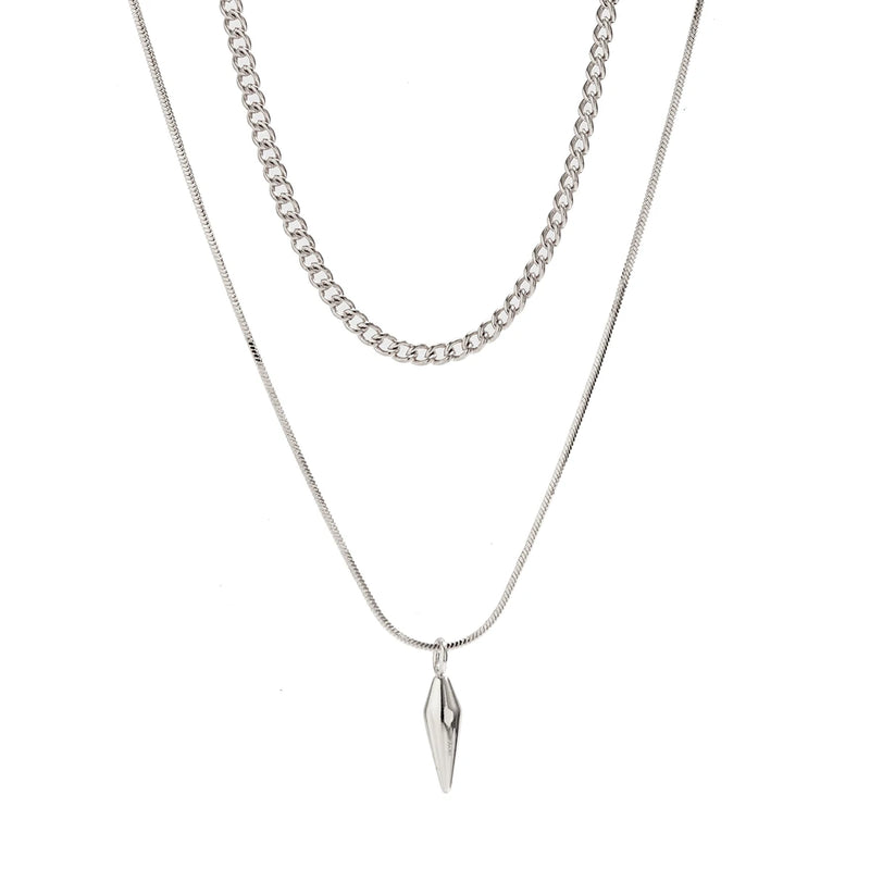 Conjunto de 2 Colares KunJoe – Estilo Punk Masculino
Destaque-se com atitude e estilo urbano.
Este conjunto inclui dois colares distintos em aço inoxidável:

1 Cuban Choker com elos largos

1 Colar com pingente de rebite