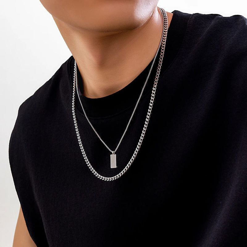 KunJoe – Conjunto de 2 Colares Masculinos Estilo Punk | Corrente Cubana + Choker com Elos Retangulares
Complete o seu visual com este conjunto exclusivo de 2 colares em prata metálica. Composto por uma corrente cubana robu